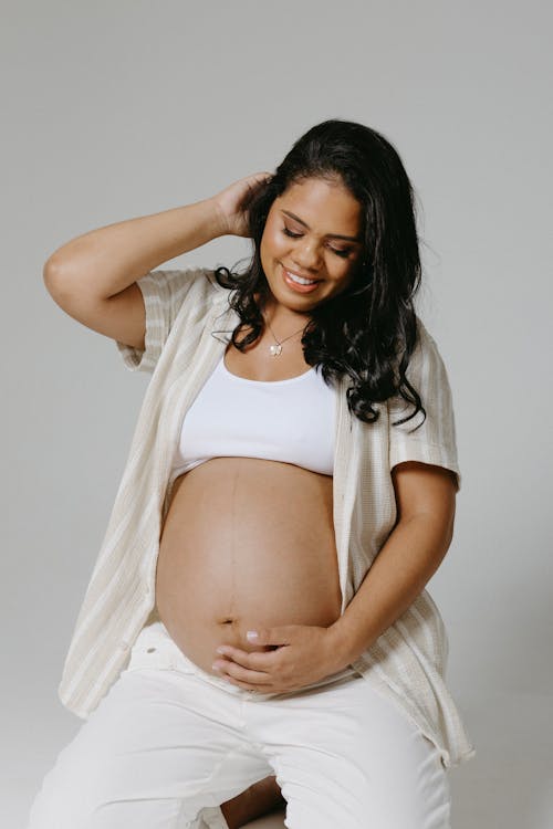 Pregnant Woman Posing in a Studio 