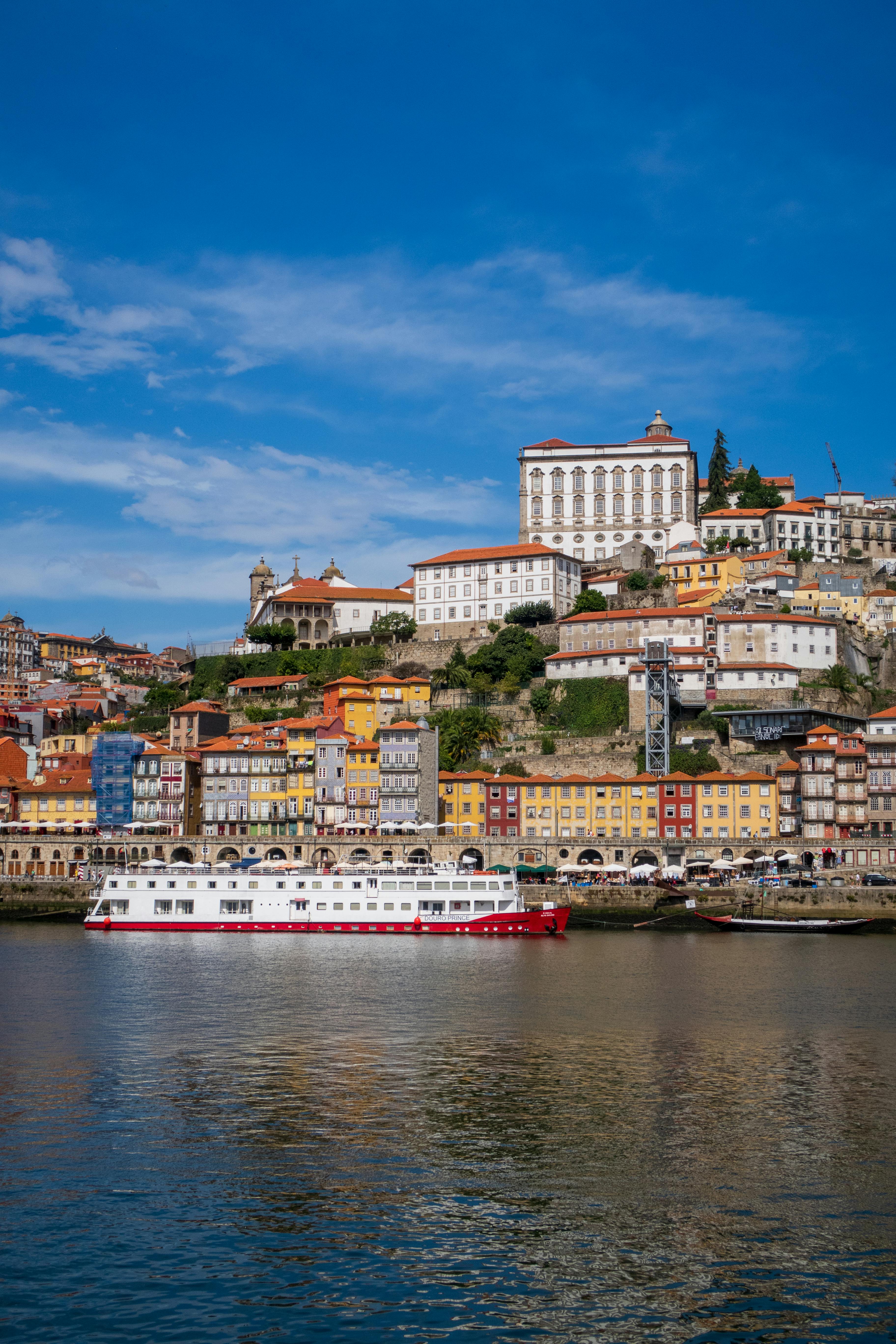 Colorful historic buildings along the Douro River in Porto, Portugal.