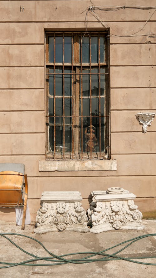 A chair and a window in front of a building