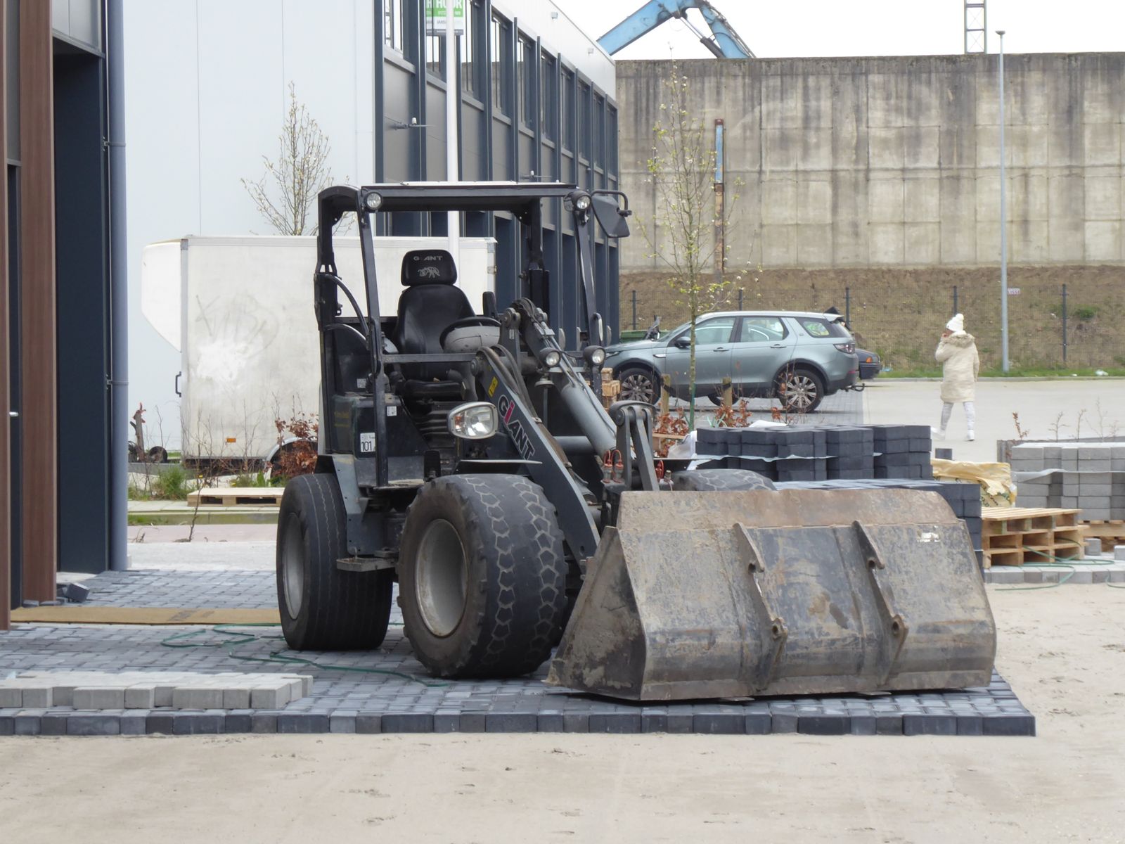 Construction site with heavy machinery and workers