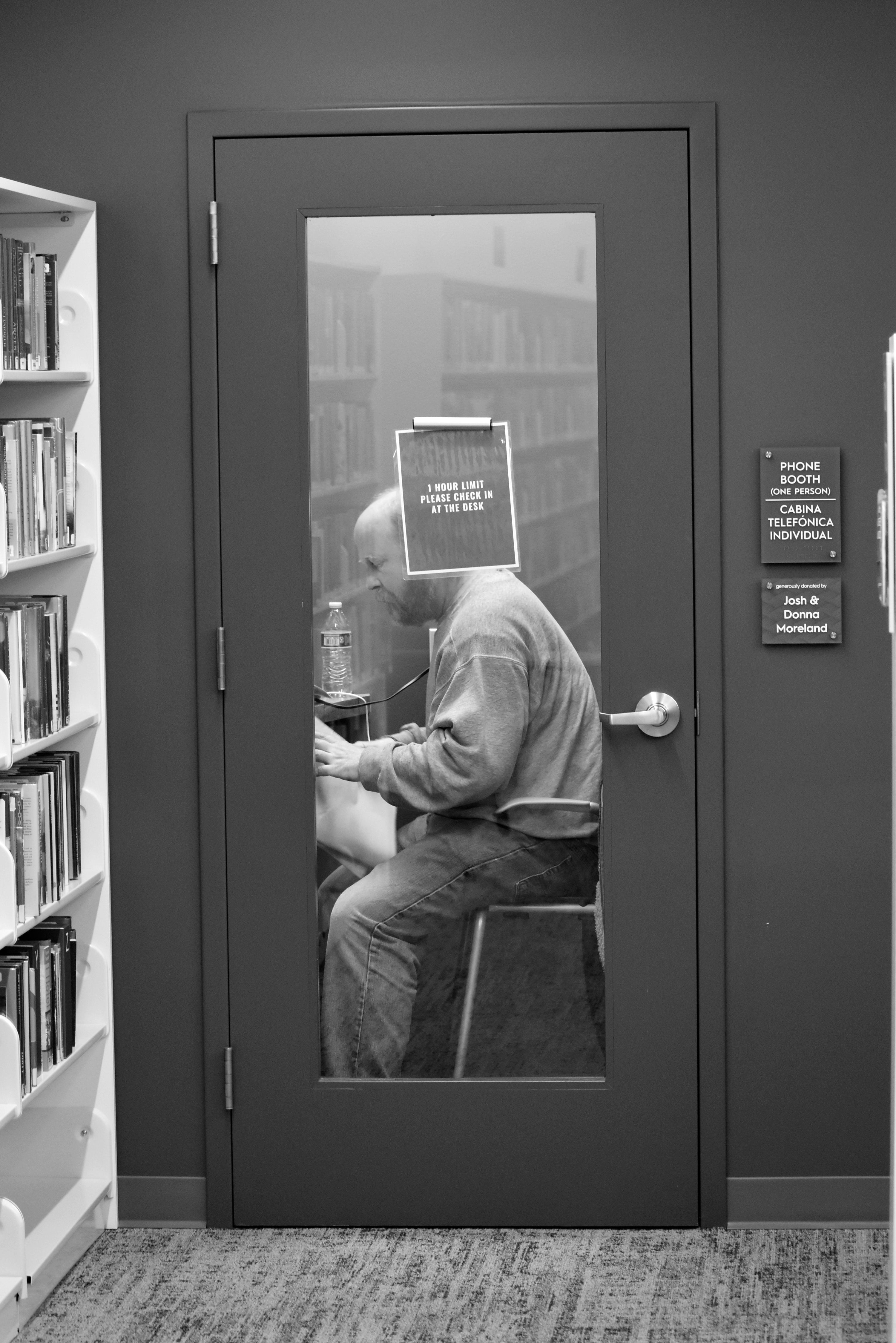 Man Sitting behind Window of Closed Door · Free Stock Photo