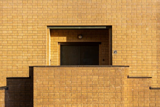 Front view of a brick building facade in The Hague, showcasing minimalistic urban architecture.