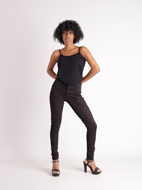 A woman in black top and black pants