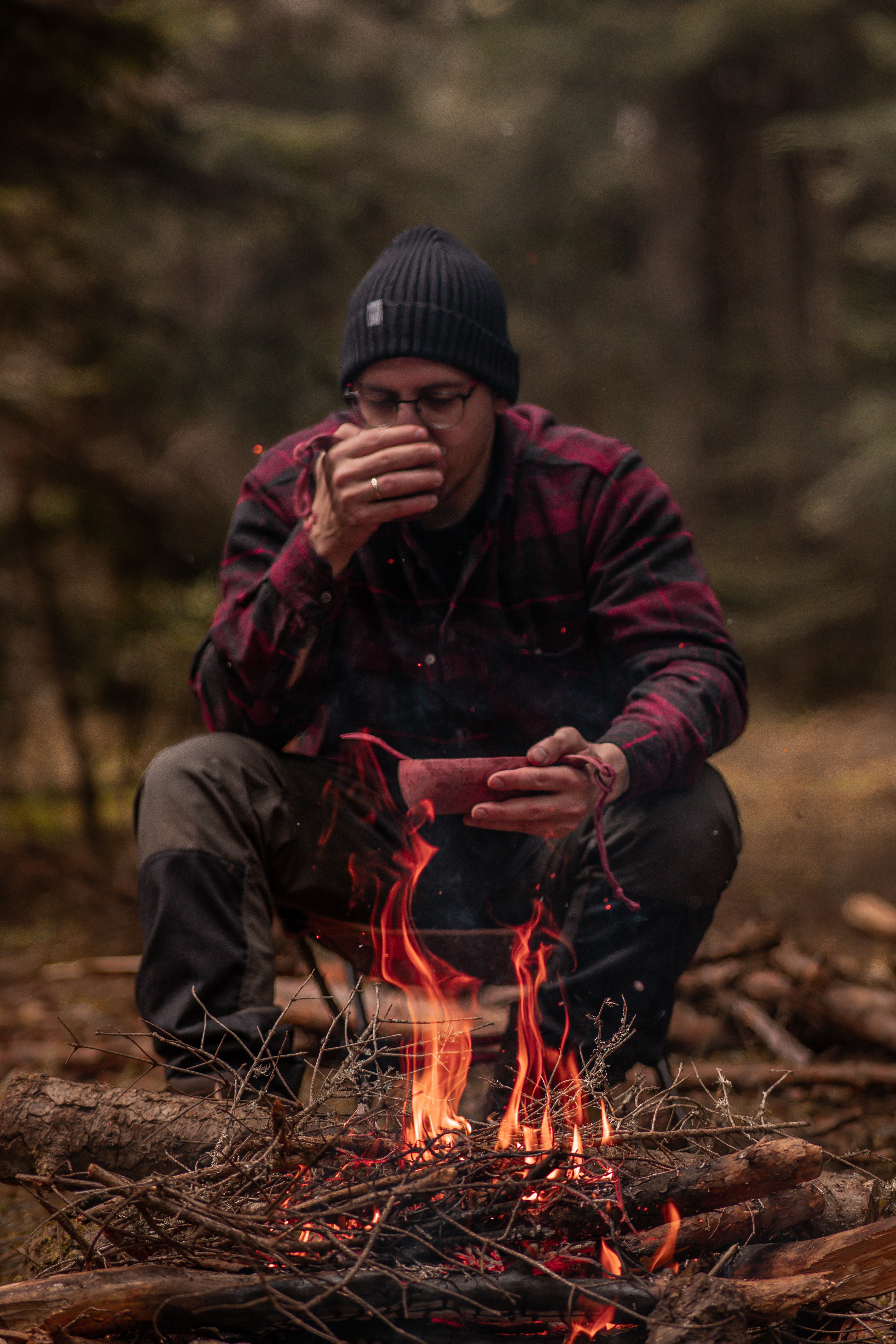 Man Sitting at Camping in Forest · Free Stock Photo