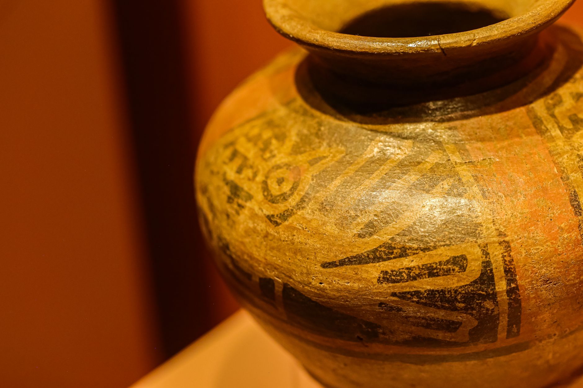 Close-up of an ancient pottery piece showcasing intricate decorative patterns.