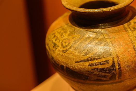 Close-up of an ancient pottery piece showcasing intricate decorative patterns.
