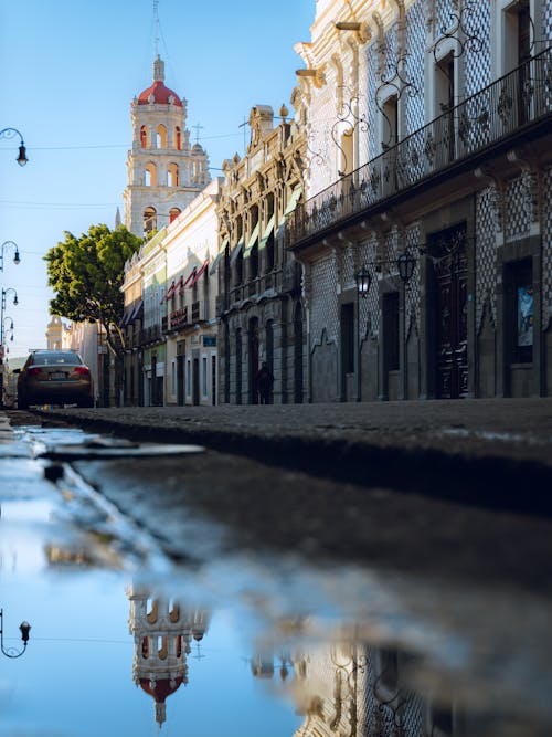 A reflection of a building in the water