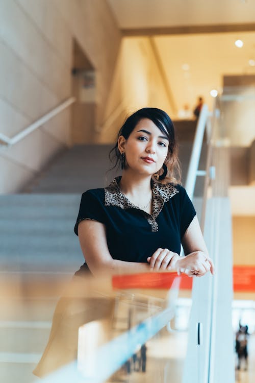 Free Focus Photography Of Woman Leaning On Stair Railing Stock Photo