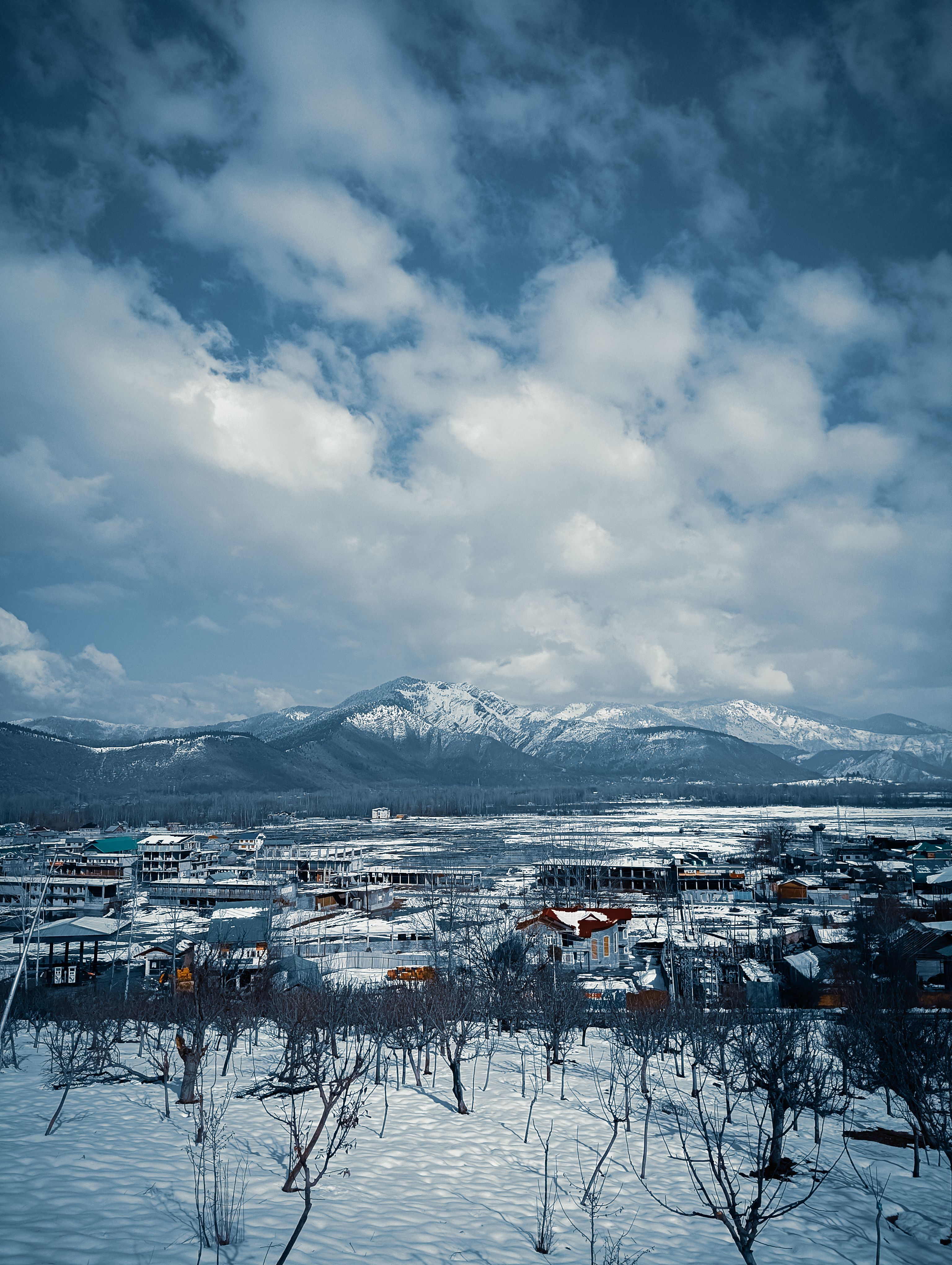 Village in a Mountain Valley Covered with Snow · Free Stock Photo
