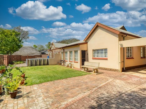 Cozy suburban house with a neat garden and driveway in Pretoria, South Africa.