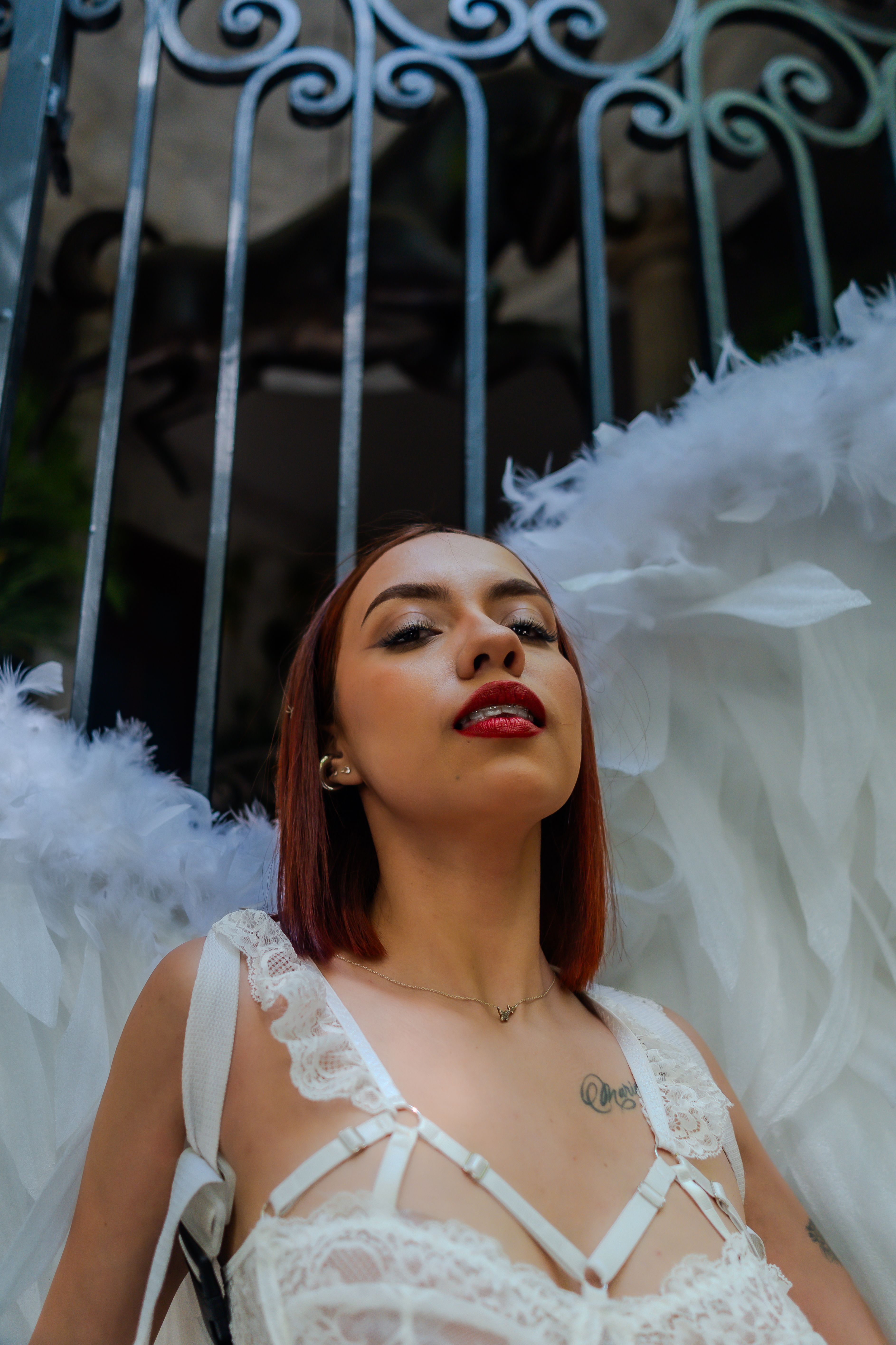 Stunning portrait of a woman with angel wings captured outdoors in Mexico City.