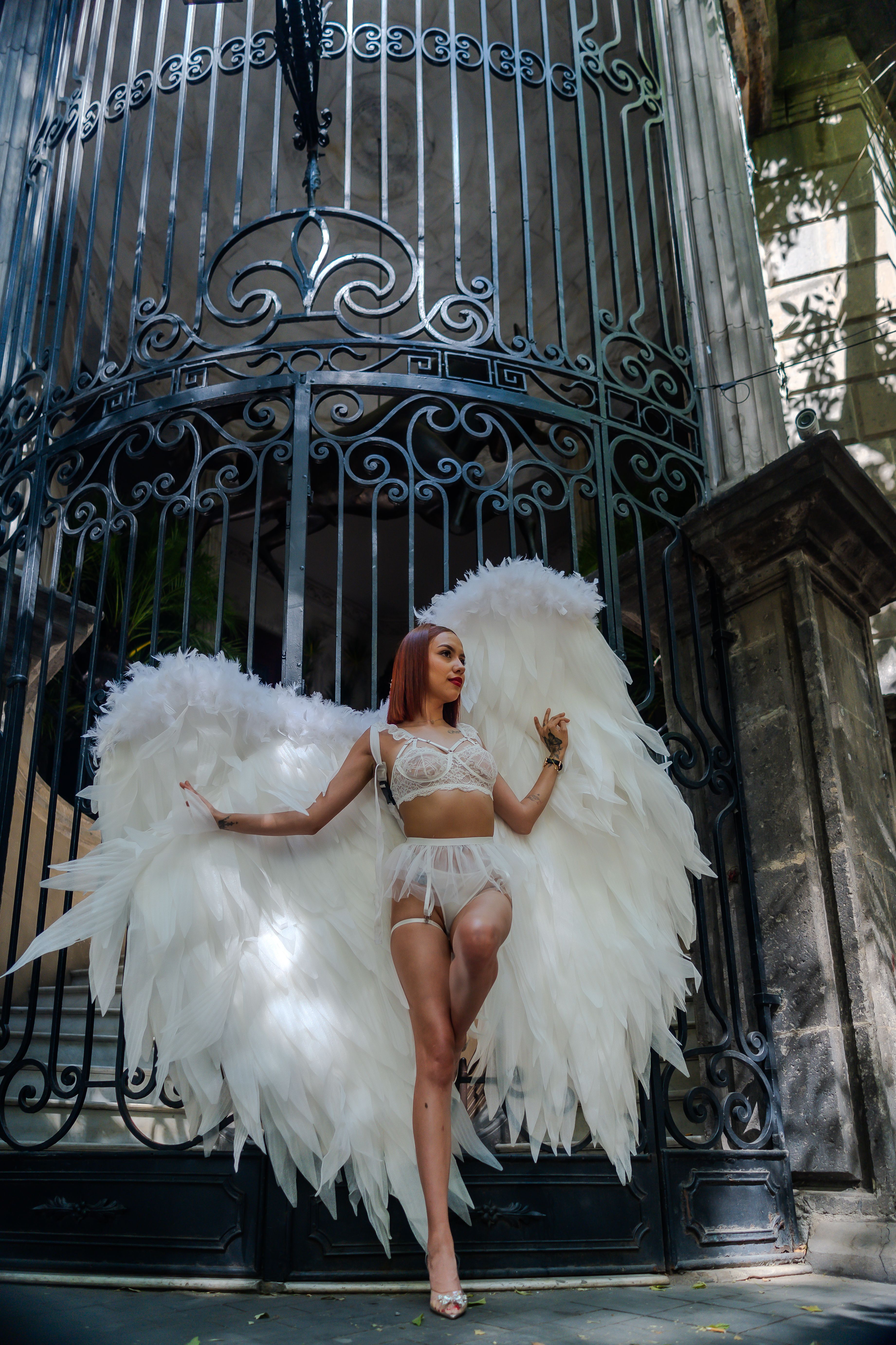 Conceptual portrait of a woman in angel wings in Mexico City.