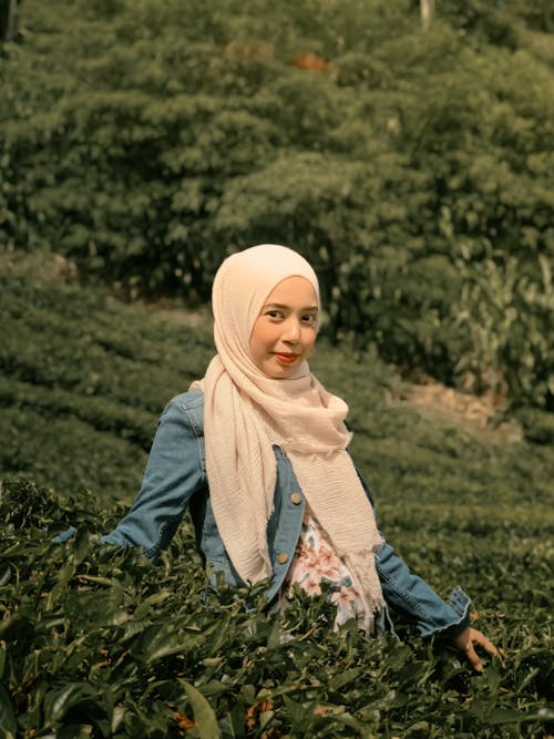 Woman in Hijab and Scarf on Field
