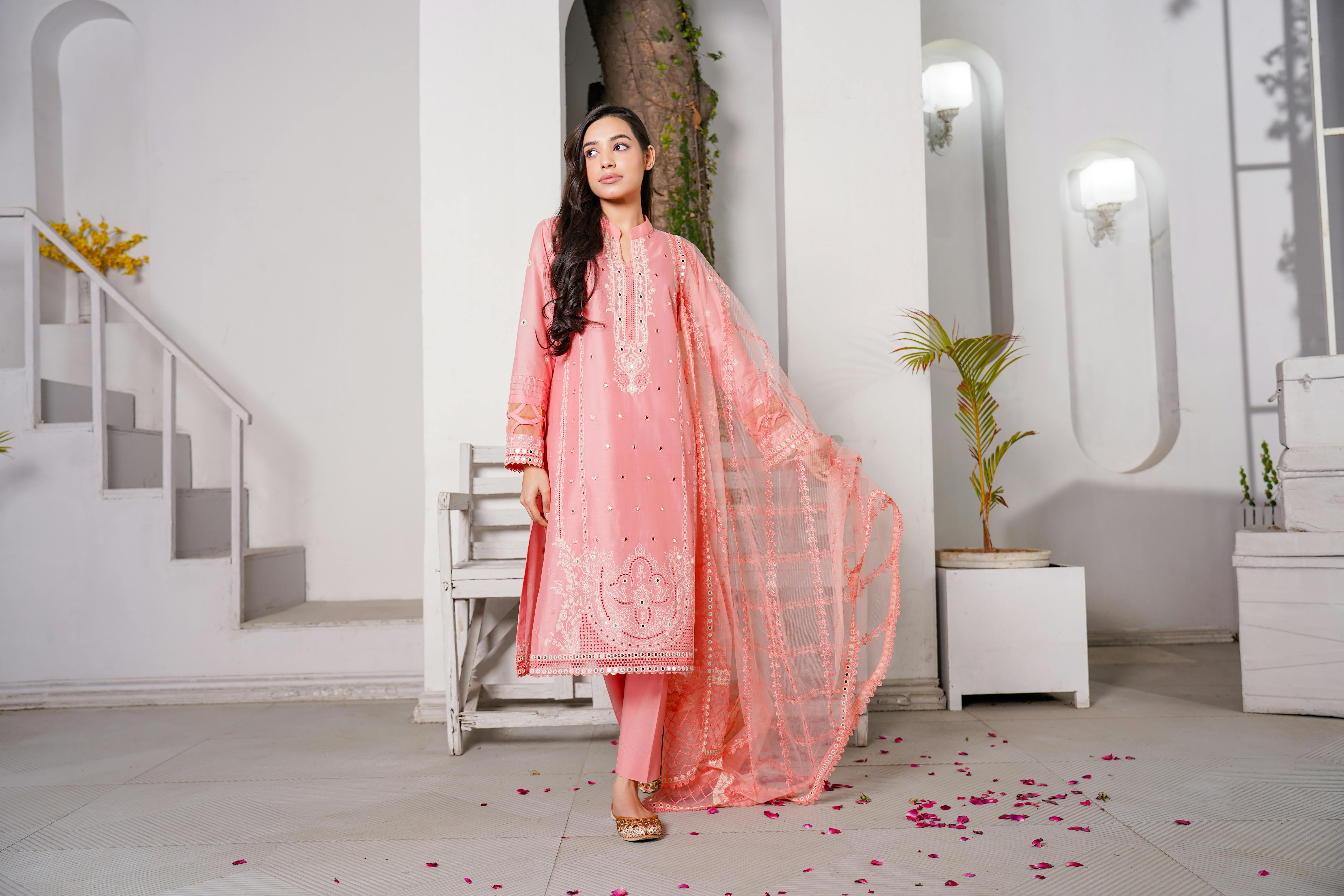 brunette woman in pink dress