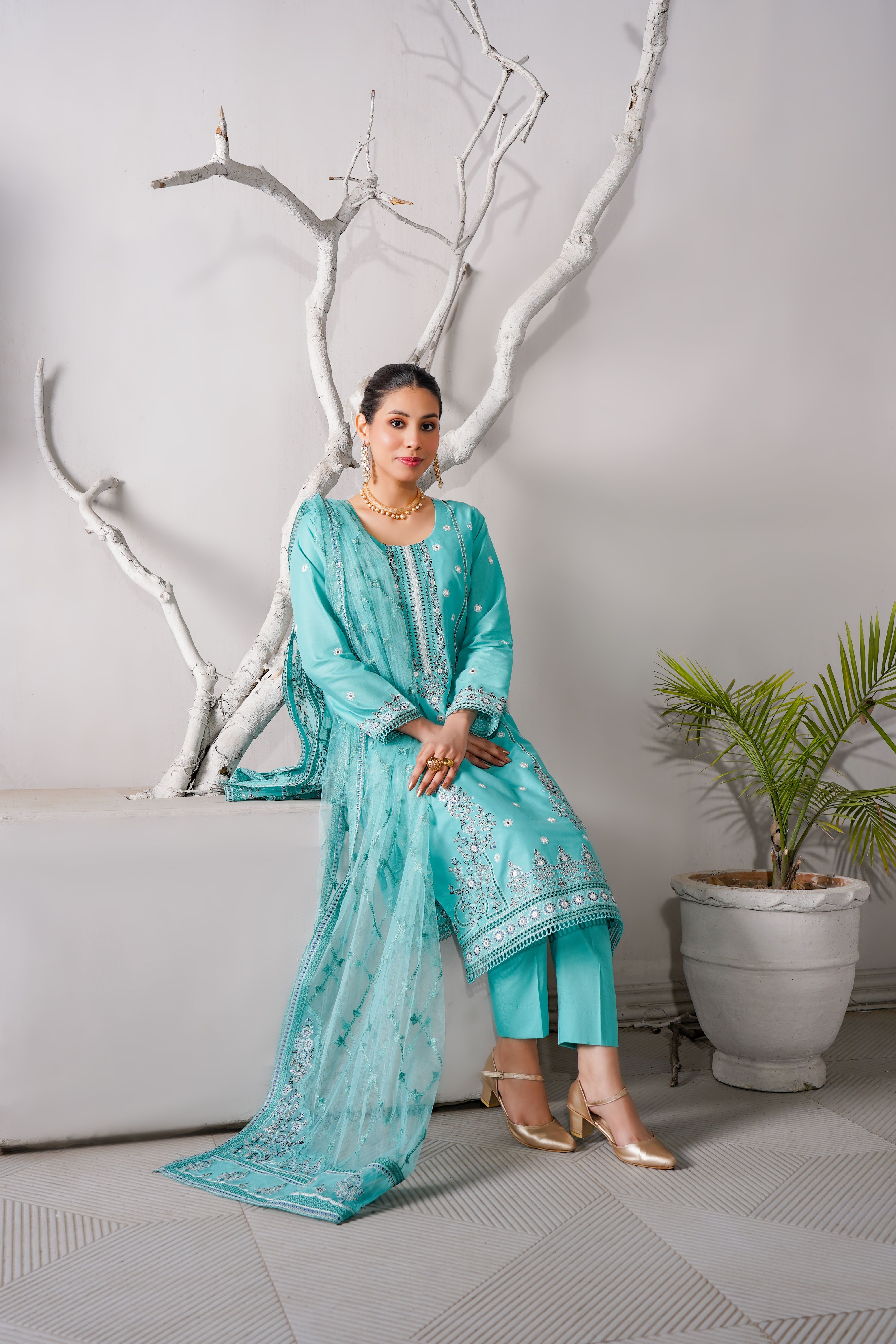 Elegant Turquoise Traditional Dress Seated