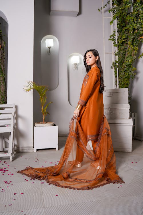 Woman Posing in an Orange Dress