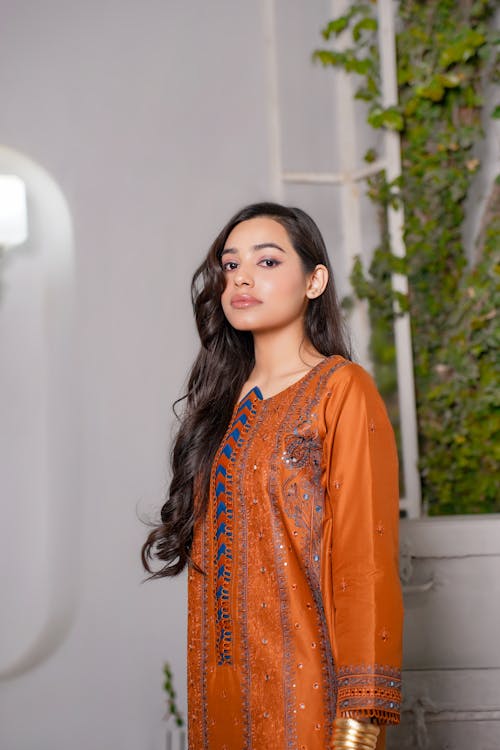 Woman Posing in an Orange Dress