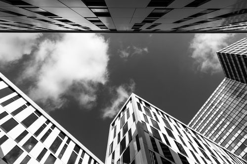 Free Dynamic low angle view of modern architecture in Hamburg under a cloudy sky. Stock Photo