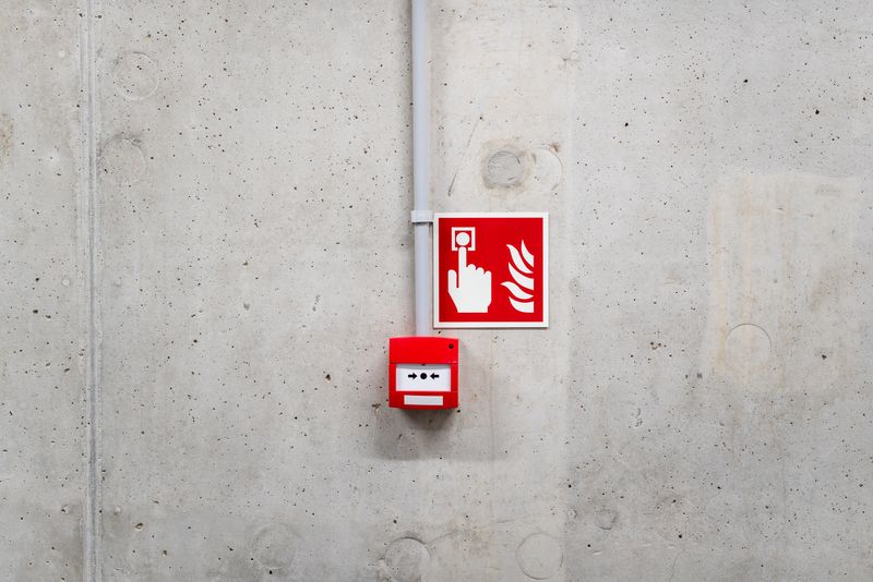 Fire alarm call point on a wall