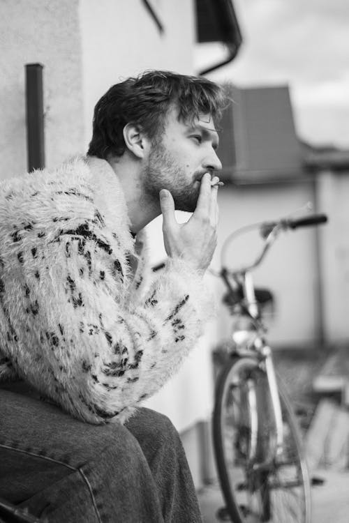 Man Smoking Cigarette in Black and White