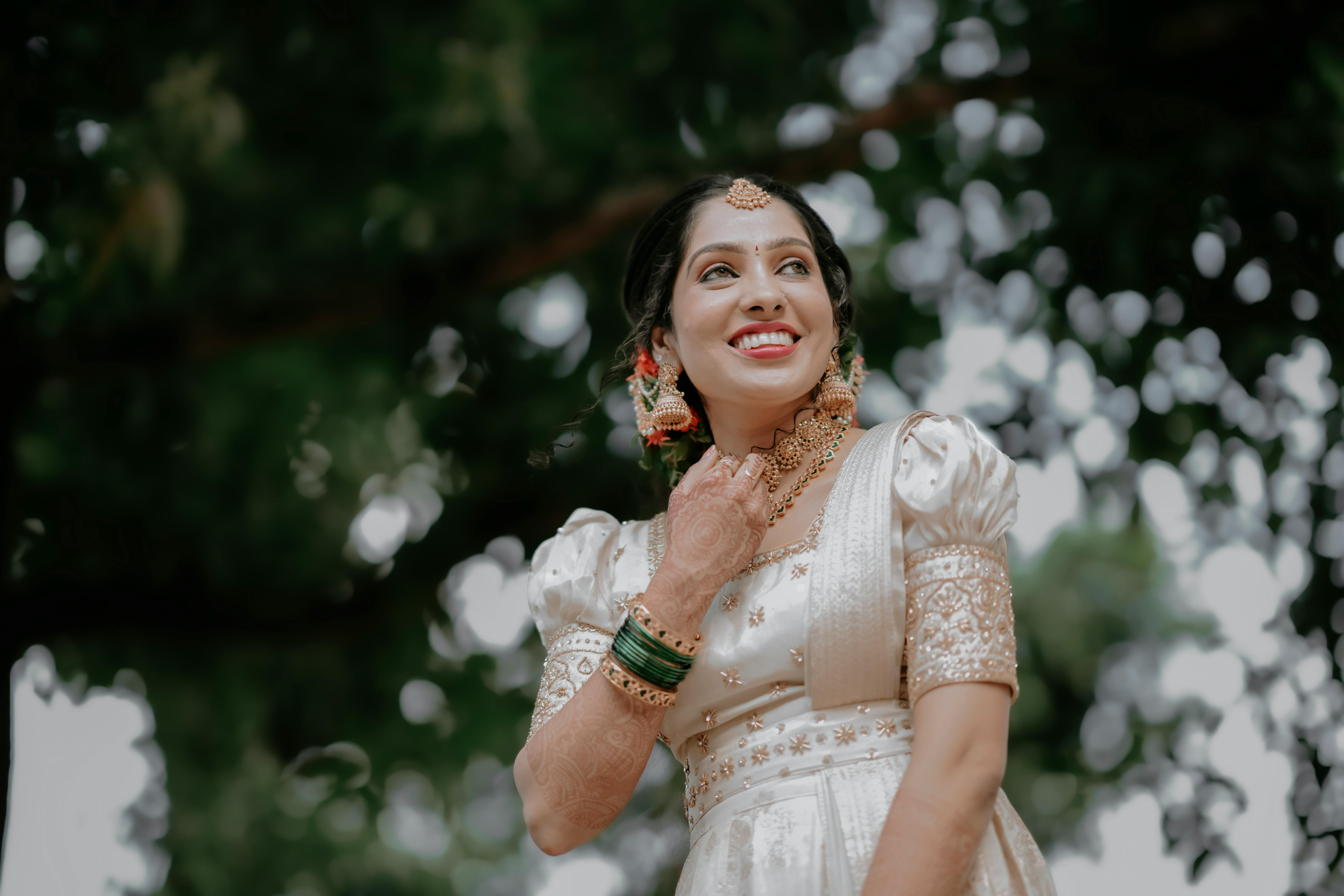 https://images.pexels.com/photos/20616430/pexels-photo-20616430/free-photo-of-a-beautiful-indian-bride-in-a-gold-dress.jpeg?auto=compress&cs=tinysrgb&w=1260&h=750&dpr=1