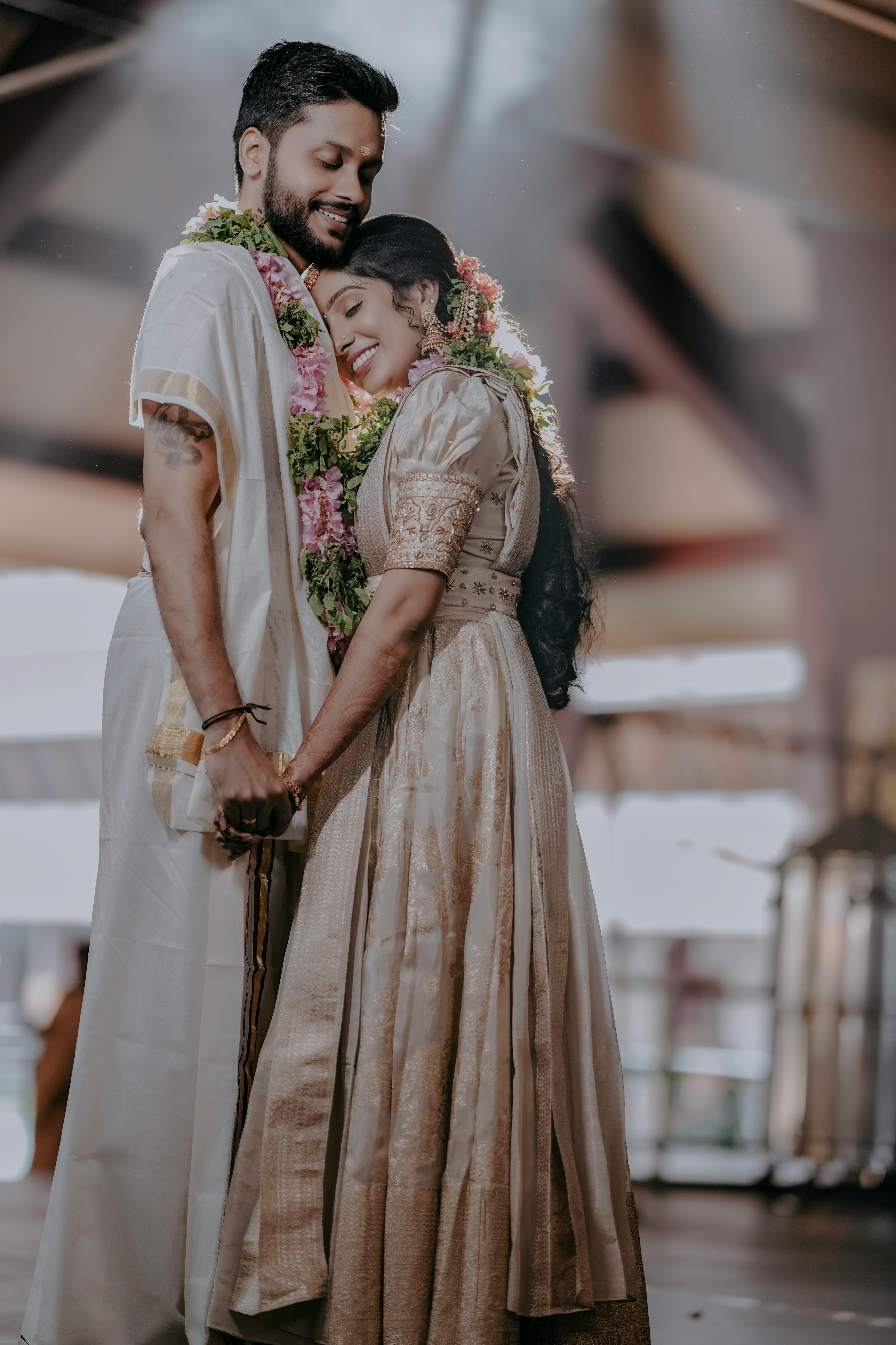 https://images.pexels.com/photos/20616441/pexels-photo-20616441/free-photo-of-a-couple-in-traditional-attire-hugging-each-other.jpeg?auto=compress&cs=tinysrgb&w=1260&h=750&dpr=1