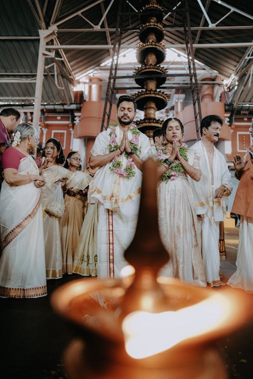 A wedding ceremony in india with people in traditional attire