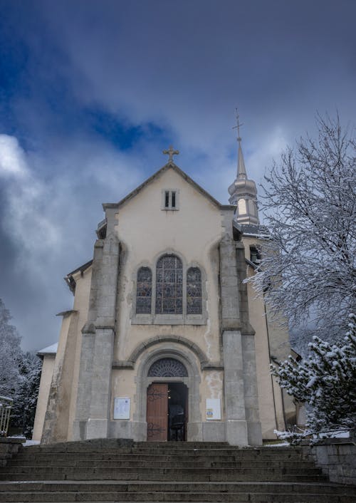 A church in the snow with steps leading up to it