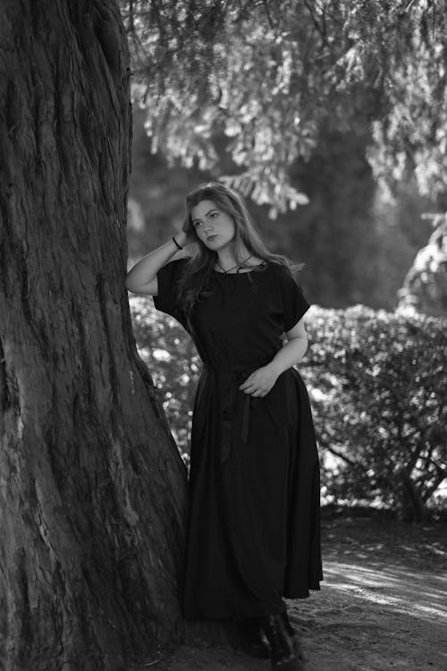 Woman in Dress Standing near Tree