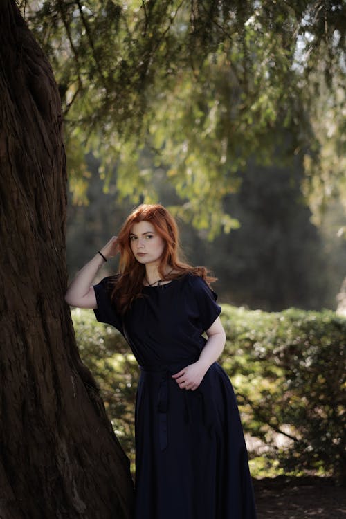 Redhead Woman in Dress at Park