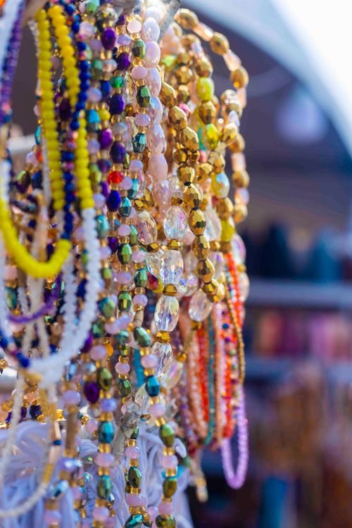 Free Vibrant assortment of beaded jewelry displayed in an Accra market. Stock Photo