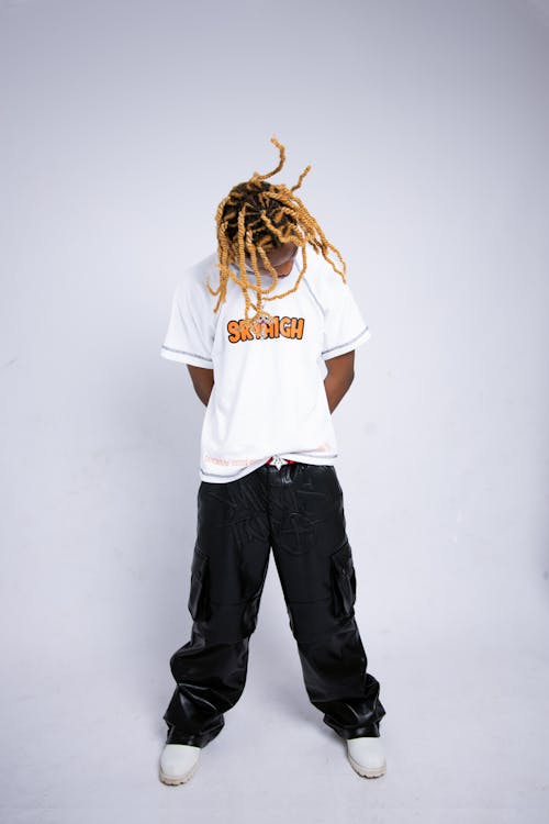 Man in T-shirt and with Blonde Dreadlocks