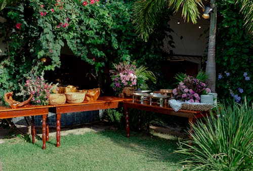 A table with food and flowers in the garden