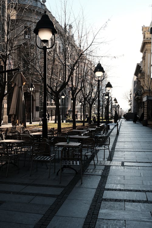 A street with tables and chairs in the middle of it