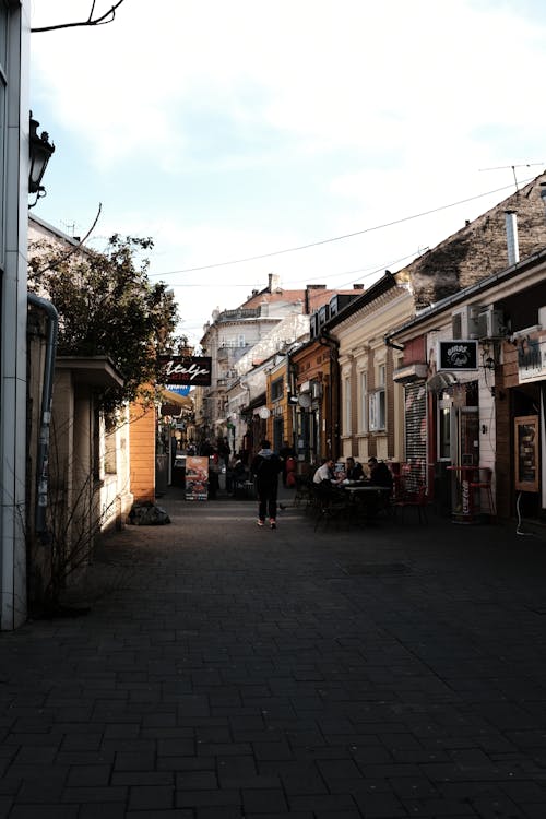 View of a Pavement between Buildings in City 