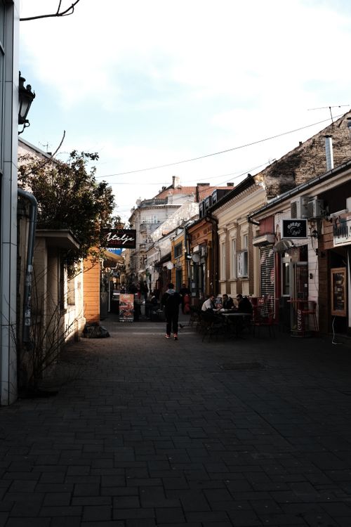 Free Explore a bustling alley in Novi Sad, Serbia, featuring shops, cafes, and vibrant urban life. Stock Photo