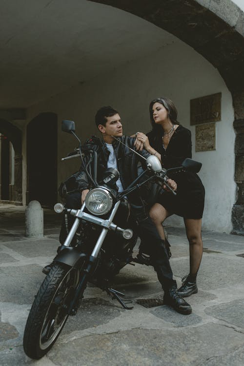 Free Couple with Motorbike Stock Photo