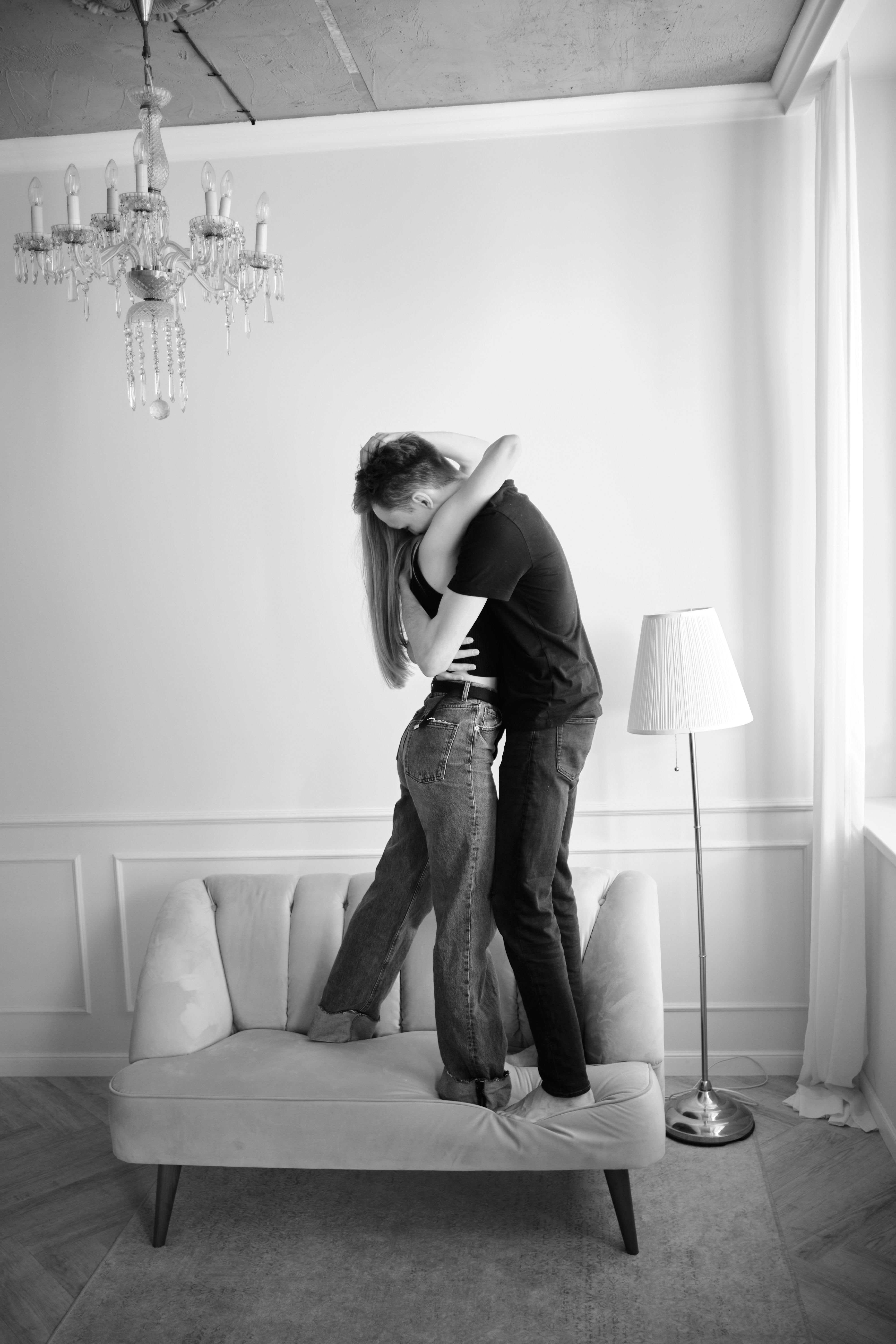 Black and White Photo of a Couple Hugging on a Sofa · Free Stock Photo
