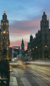 Explore the vibrant cityscape of Budapest at dusk, showcasing historic architecture and urban life.