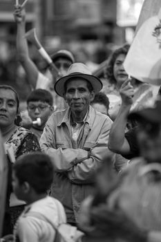 Black and white image capturing a group protest in Guatemala City, featuring diverse participants.