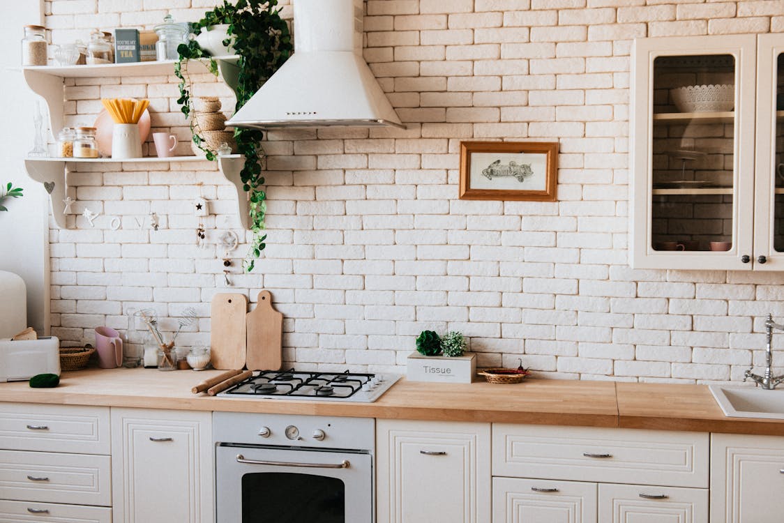 Free Chopping Boards Near Oven Under Hood Stock Photo