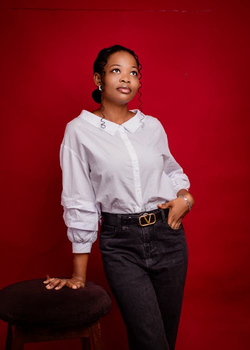 A woman in a white shirt and black pants