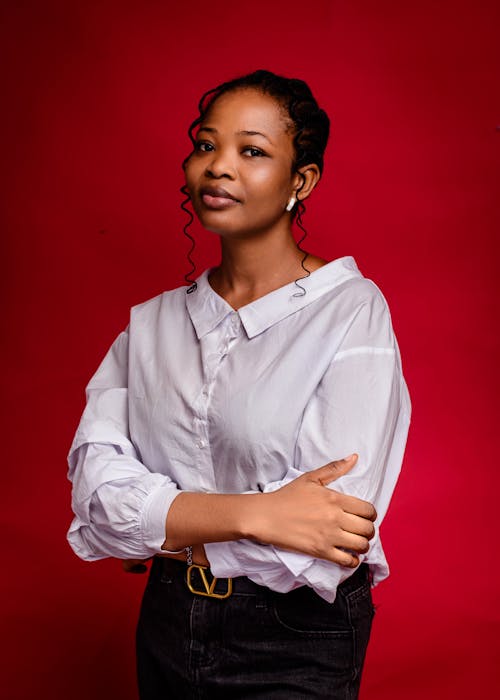 A woman in a white shirt and black pants