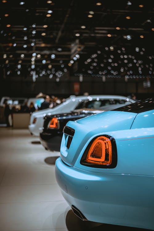 Teal, Black, and White Luxury Cars