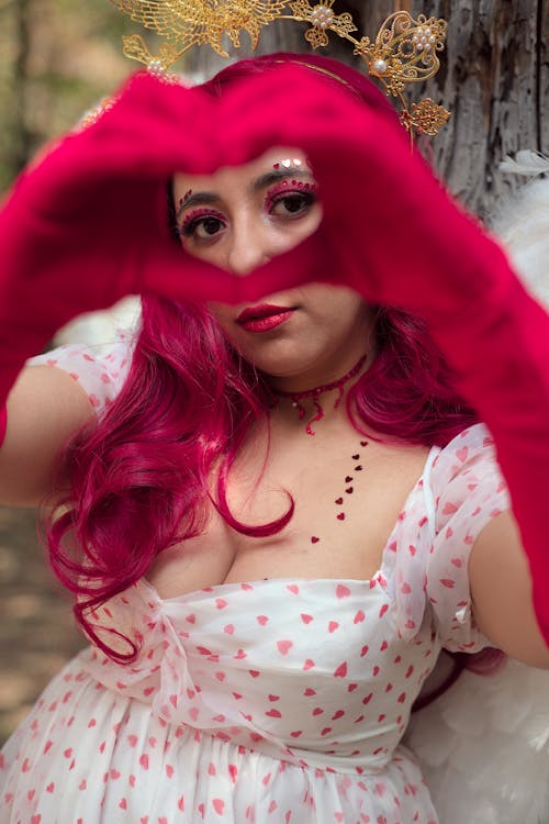 Woman with Pink Hair and Gloves, Making a Heart Gesture