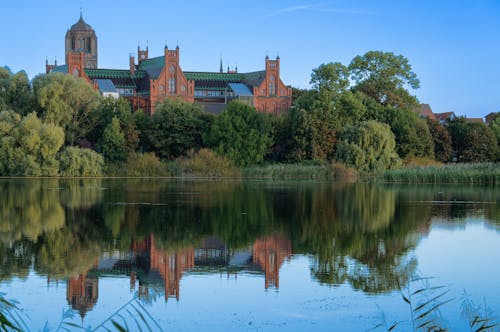 school with reflections in a lake