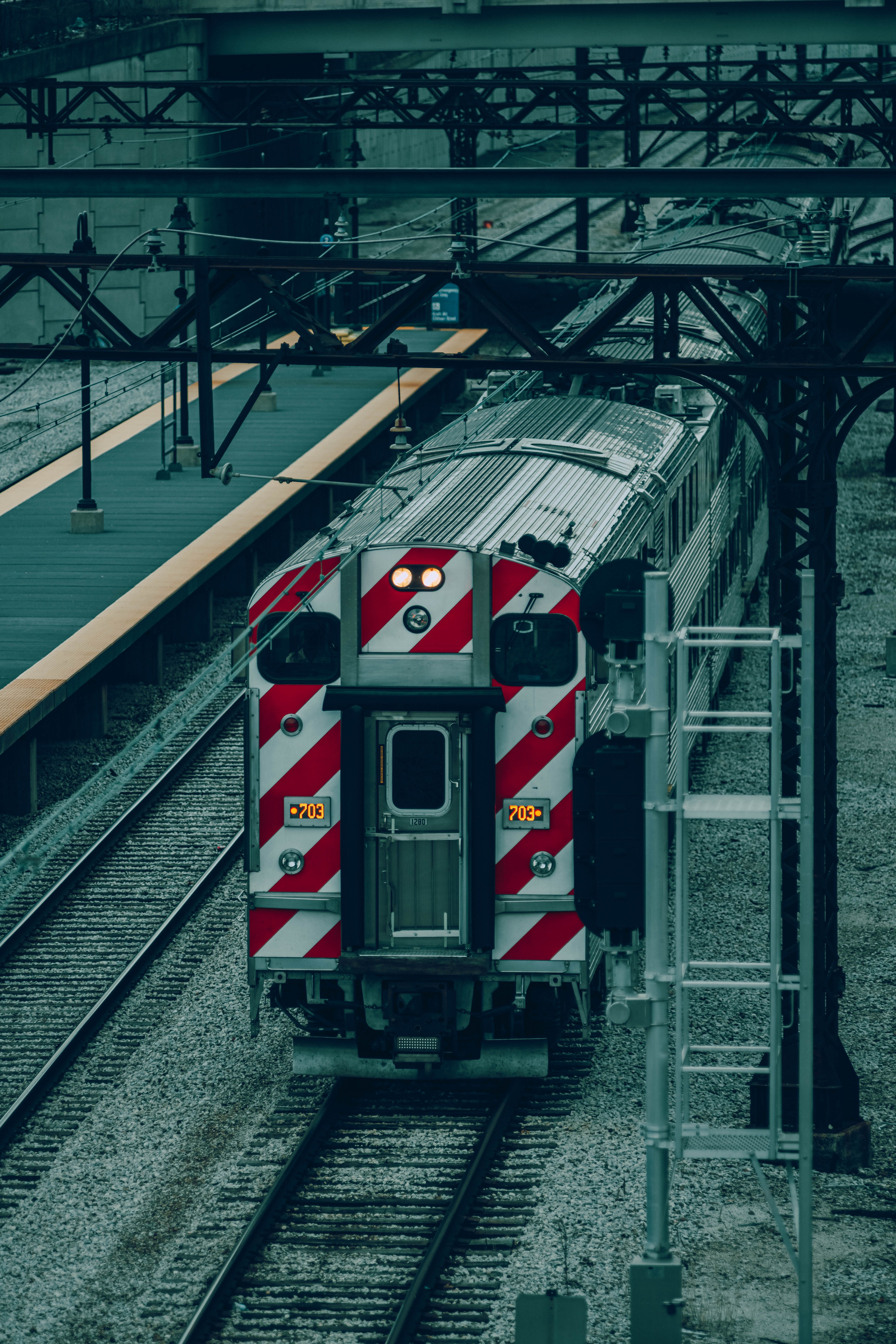 Back of a Train on Railroad Tracks · Free Stock Photo