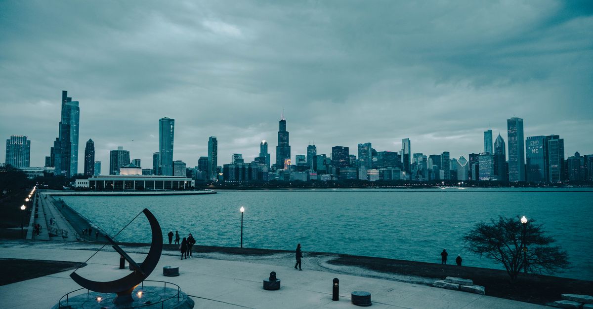 Stunning Chicago skyline from the waterfront with overcast skies.