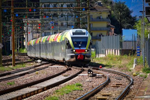 Free A colorful modern train at a railway station in Bozen, Italy on a sunny day. Stock Photo