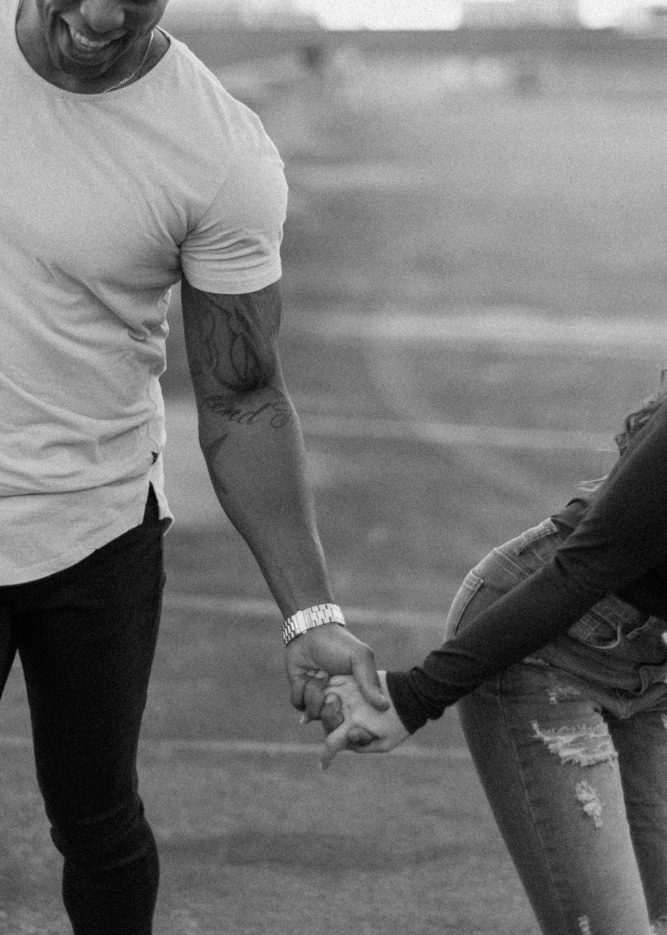 Couple Holding Hands in Black and White · Free Stock Photo
